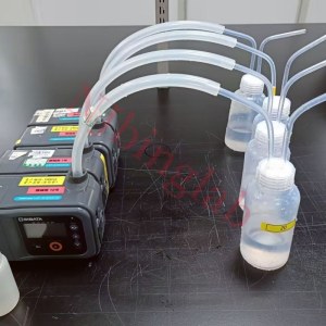 PFA gas washing bottle connected to air sampling pump