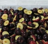 Frozen plum halves